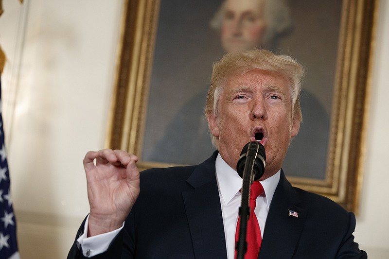 
              FILE - In this Aug. 14, 2017 file photo, President Donald Trump speaks in front of a portrait of George Washington, in the Diplomatic Room of the White House in Washington. Both were great generals. Both Virginians. Both came from slave-owning plantation families.
Is it really so far-fetched to put Robert E. Lee in the same category as George Washington, as President Donald Trump suggested Tuesday, Aug. 15, 2017?  (AP Photo/Evan Vucci, File)
            