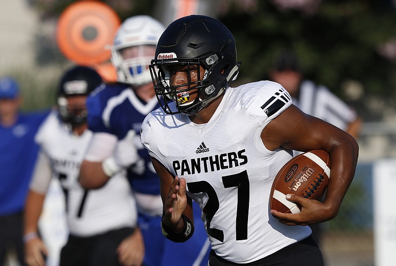 Ridgeland quarterback Jalyn Shelton carries during a high school football scrimmage at Ringgold High School on Thursday, Aug. 10, 2017, in Ringgold, Ga.