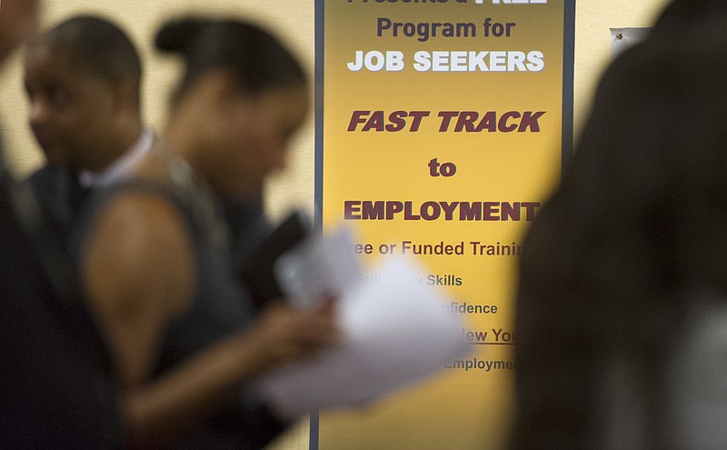 
              FILE - In this May 30, 2013, file photo, job seekers line up to talk to recruiters during a job fair held in Atlanta. On Thursday, Aug. 17, 2017, the Labor Department reports on the number of people who applied for unemployment benefits a week earlier. (AP Photo/John Amis, File)
            