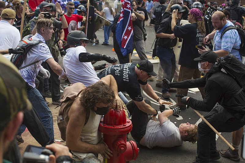 Fighting in the streets of Charlottesville, Va., where white nationalists faced counter-protestors at a planned protest, billed as a “Unite the Right” rally, Aug. 12, 2017. The demonstration, which both organizers and critics had said was the largest gathering of white nationalists in recent years, turned violent almost immediately; a car that plowed into a crowd of counterprotesters later left at least one person dead and at least 19 injured. (Matt Eich/The New York Times)