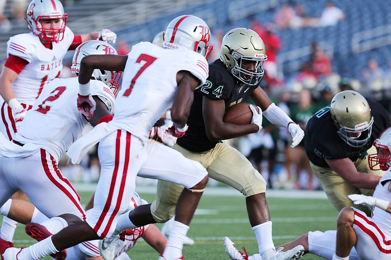 Notre Dame's Akil Sledge (24) runs the ball in for Notre Dame's only touchdown during the first half of their game against Baylor Thursday, Aug. 17, 2017, at Finley Stadium in Chattanooga, Tenn. 