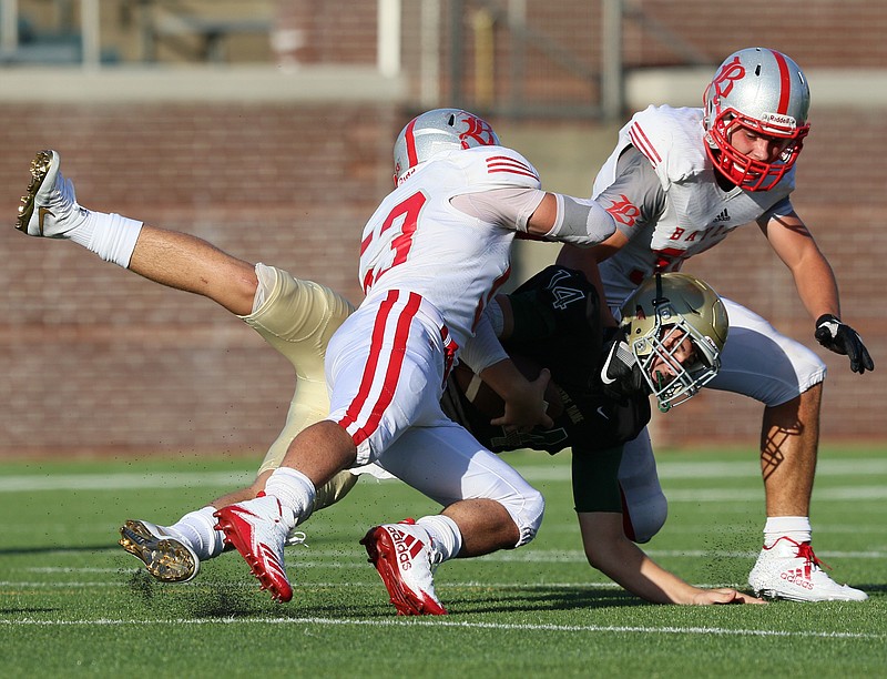 Baylor's Alberto Marset Ehrle (53) and Gus Howard (36) tackle Notre Dame quarterback Landon Allen (14) behind the line of scrimmage Thursday, Aug. 17, 2017, at Finley Stadium in Chattanooga, Tenn. 