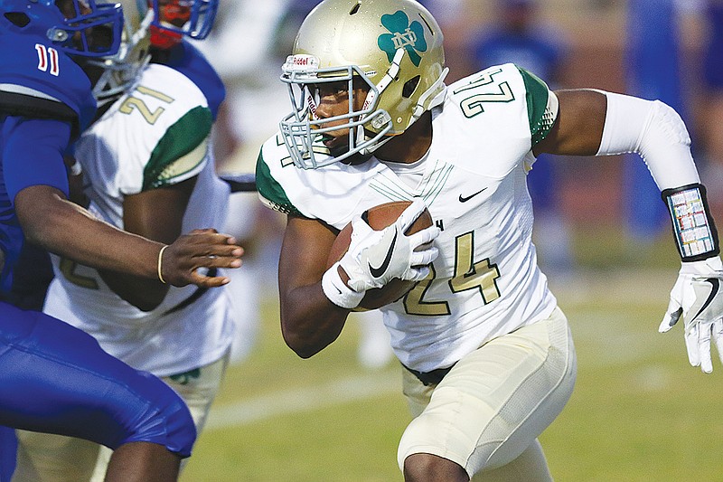 Notre Dame High School's Akil Sledge looks for running room.