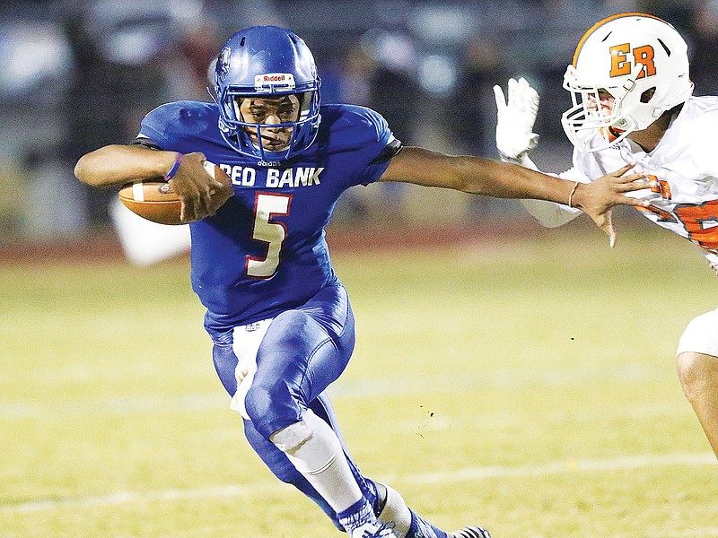 Red Bank High School's Calvin Jackson (5) dodges a tackle on his way to a big gain. Jackson has moved from quarterback to receiver this season.