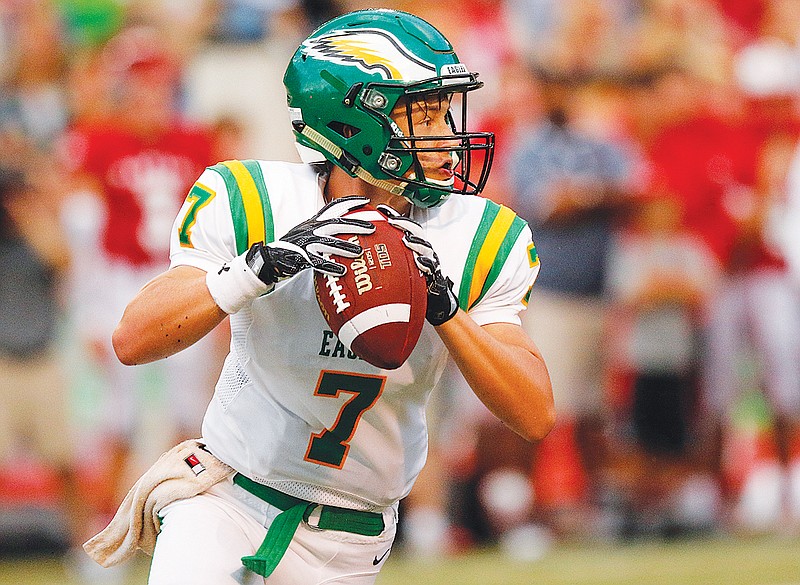 Rhea County quarterback Zach Pemberton looks for an open receiver.