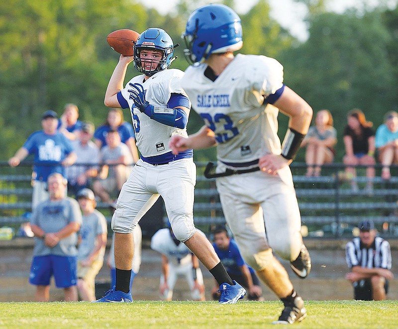 Sale Creek quarterback Tanner Harvey passes to Nathan Hutchings during a scrimmage against Silverdale Baptist this month.