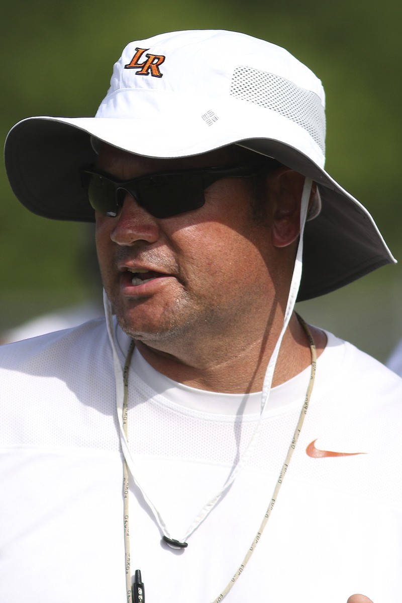 LaFayette's football coach Chad Fisher works with his players during a passing camp at LaFayette High School on July 7, 2015. Fisher's Rambler finished with a 3-7 record last season.