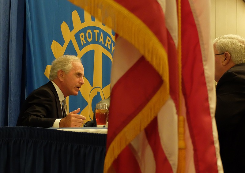 Staff photo by Tim Barber U.S. Sen. Bob Corker, R-Tenn., talks to a member of the Rotary Club of Chattanooga Thursday at the Chattanooga Convention Center.
