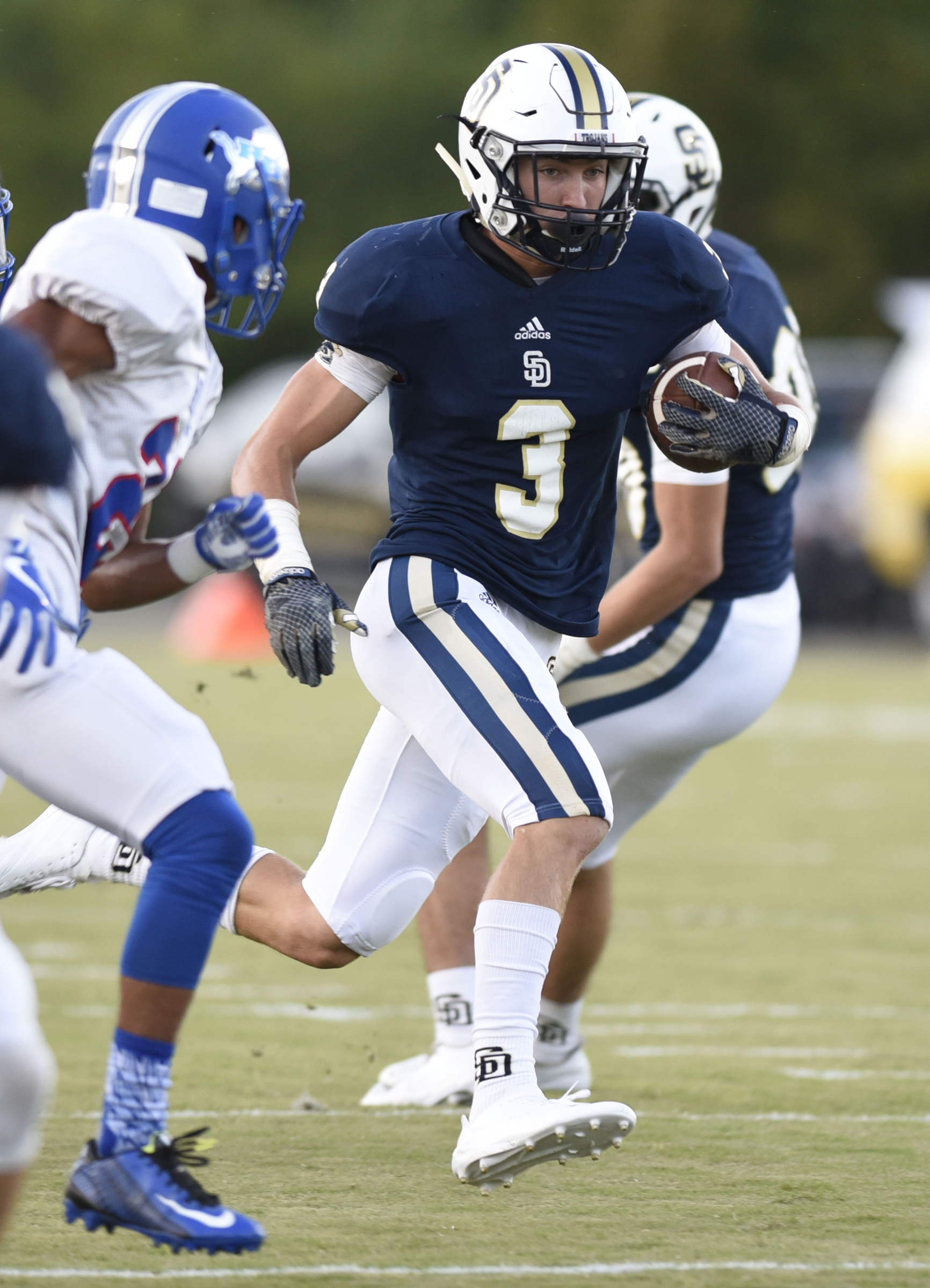 Soddy-Daisy's Brandon Davis (3) breaks into the Lion secondary. The Red Bank Lions visited the Soddy-Daisy Trojans in TSSAA football action at Soddy-Daisy High School on August 18, 2017.