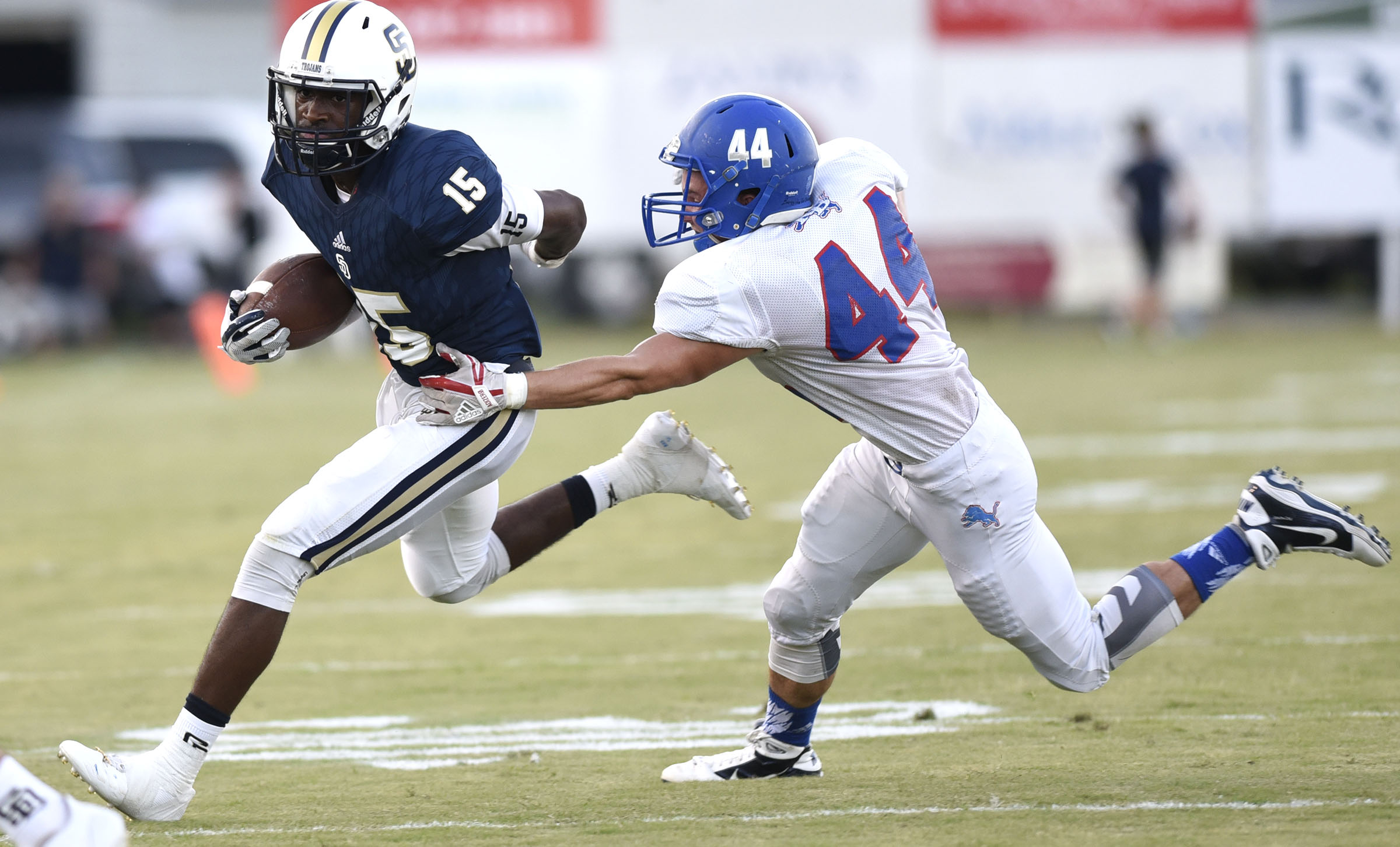 Red Bank's Devin Duncan (44) catches Soddy-Daisy's Jarvis Smith (15) in the backfield. The Red Bank Lions visited the Soddy-Daisy Trojans in TSSAA football action at Soddy-Daisy High School on August 18, 2017.