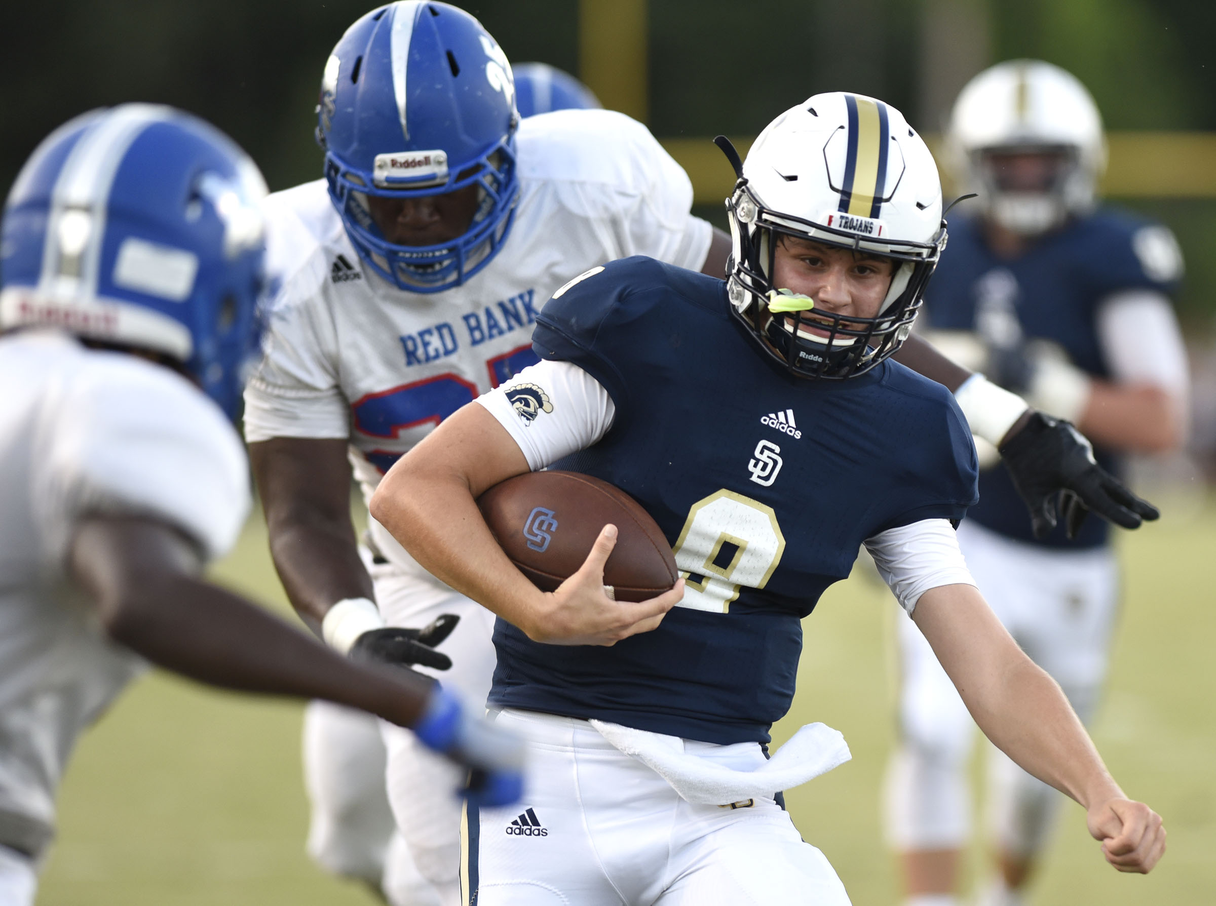 Soddy-Daisy quarterback Gavin Chambers (8) takes the ball down to the lion 2 yard line. The Red Bank Lions visited the Soddy-Daisy Trojans in TSSAA football action at Soddy-Daisy High School on August 18, 2017.