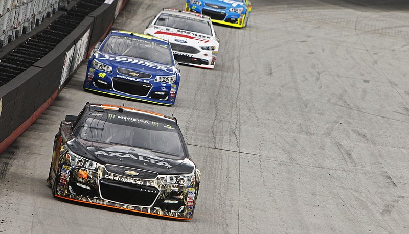 
              Driver Dale Earnhardt Jr. (88) leads Jimmie Johnson (48) and Matt DeBenedetto (32) during practice for the NASCAR Monster Energy Cup auto race, Friday, Aug. 18, 2017 in Bristol, Tenn. (AP Photo/Wade Payne)
            