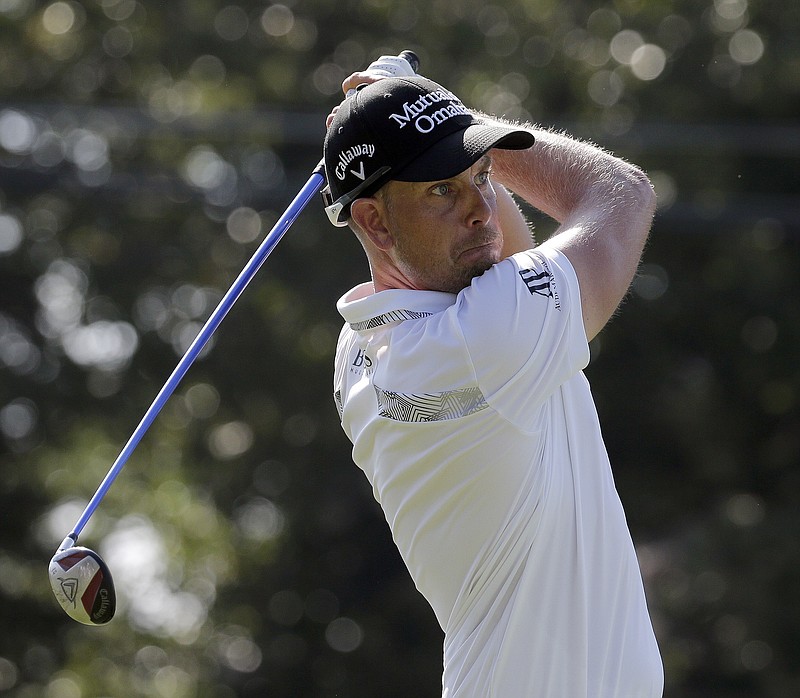 
              Henrik Stenson, of Sweden, watches his tee shot on the 18th hole during the second round of the Wyndham Championship golf tournament in Greensboro, N.C., Friday, Aug. 18, 2017. (AP Photo/Chuck Burton)
            