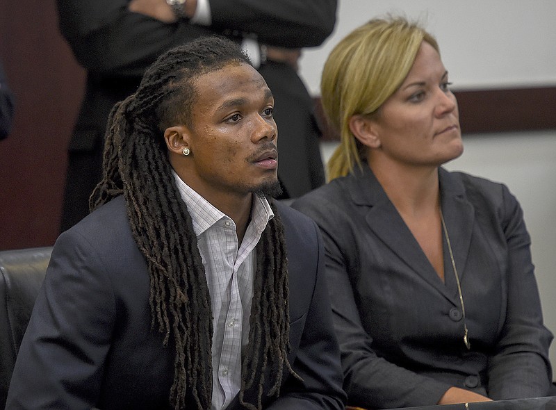 
              FILE - In this June 23, 2017, file photo, Brandon Banks, left, and his attorney Katie Hagan react after the verdict was read in his trial in Nashville, Tenn. Banks, a former Vanderbilt University football player, has been sentenced to 15 years in prison Friday, Aug. 18, 2017, for the 2013 rape of an unconscious female student. (Lacy Atkins/The Tennessean via AP, File)
            