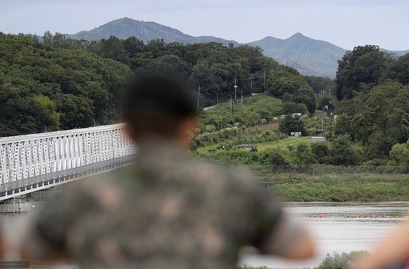 
              FILE- In this Aug. 16. 2017, file photo, a South Korean soldier watches the north side at the Imjingak Pavilion in Paju, South Korea. The U.S. intelligence agencies’ assessments of the size of North Korea’s nuclear arsenal have a wide gap between high and low estimates. Size matters and not knowing makes it harder for the United States to develop a policy for deterrence and defend itself and allies in the region. The secrecy of North Korea's nuclear program, the underground nature of its test explosions and the location of its uranium-enrichment activity has made it historically difficult to assess its capabilities. (AP Photo/Lee Jin-man, File)
            