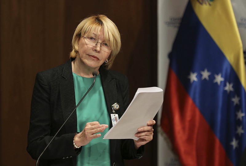 
              FILE - In this June 28, 2017 file photo, Venezuela's chief prosecutor Luisa Ortega speaks during a press conference in Caracas, Venezuela. The ousted chief prosecutor fled to Colombia with her husband German Ferrer, on Friday, Aug. 18, 2017, a day after the Supreme Court ordered his arrest. (AP Photo/Fernando Llano, File)
            
