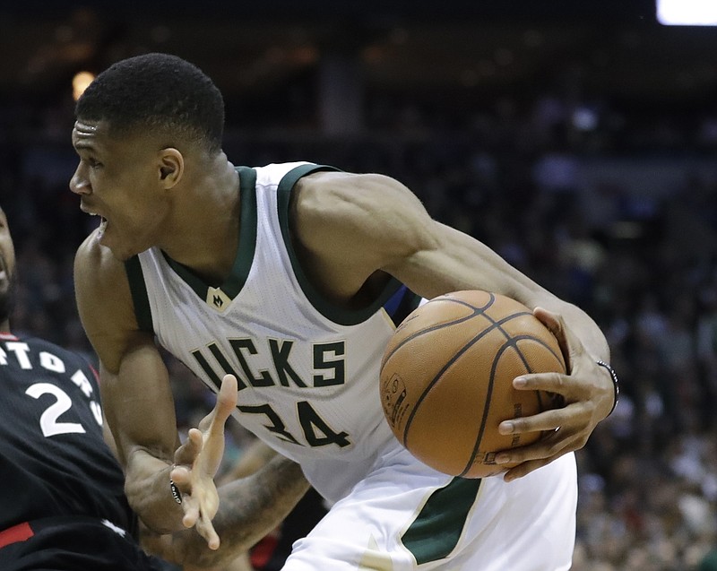 
              FILE - In this file photo dated Thursday, April 27, 2017, Milwaukee Bucks' Giannis Antetokounmpo runs with the ball during the second half of Game 6 of an NBA first-round playoff series basketball game in Milwaukee, USA.  Greece's basketball federation on Saturday Aug. 19, 2017, has accused the Milwaukee Bucks and the NBA of hatching a plan to prevent Giannis Antetokounmpo from playing in the European championship. (AP Photo/Morry Gash, FILE)
            