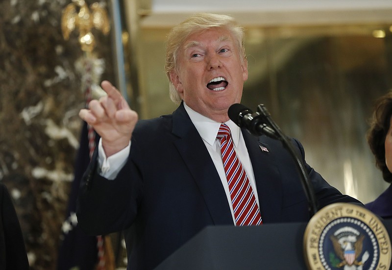 
              In this photo taken Aug. 15, 2017, President Donald Trump speaks to the media in the lobby of Trump Tower in New York. President Donald Trump's response to white supremacist violence in Virginia has left Democrats in a quandary. They want to seize the moral high ground, but without getting sucked into a politically risky culture war.  (AP Photo/Pablo Martinez Monsivais)
            