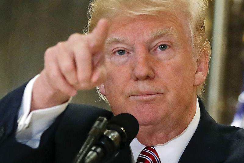 
              In this Aug. 15, 2017, photo, President Donald Trump points to members of the media as he answers questions in the lobby of Trump Tower in New York. Trump’s racially fraught comments about a deadly neo-Nazi rally have thrust into the open some Republicans’ deeply held doubts about his competency and temperament, in an extraordinary public airing of worries and grievances about a sitting president by his own party.   (AP Photo/Pablo Martinez Monsivais)
            