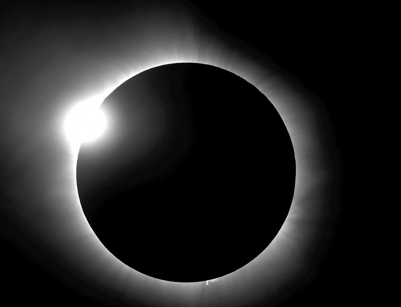 This photo provided by Bob Baer and Sarah Kovac, participants in the Citizen CATE Experiment, shows a "diamond ring" shape during the 2016 total solar eclipse in Indonesia. For the 2017 eclipse over the United States, the National Science Foundation-funded movie project nicknamed Citizen CATE will have more than 200 volunteers trained and given special small telescopes and tripods to observe the sun at 68 locations in the exact same way. The thousands of images from the citizen-scientists will be combined for a movie of the usually hard-to-see sun’s edge. (R. Baer, S. Kovac/Citizen CATE Experiment via AP)