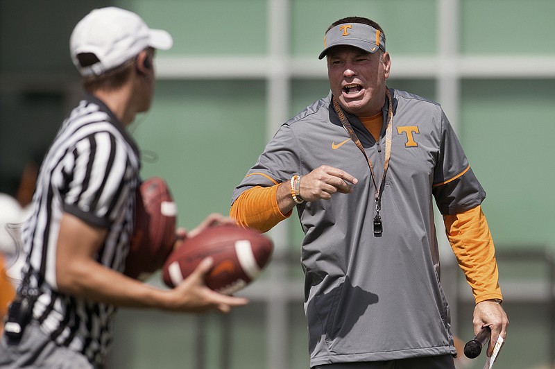 Coach Butch Jones, right, is entering his fifth season at Tennessee with a growing feeling of dissatisfaction from Vols fans.