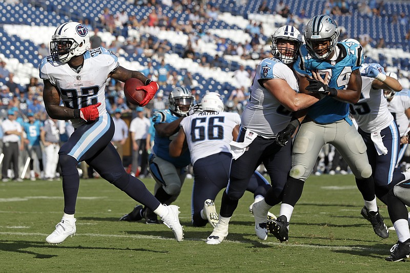 Tennessee Titans running back David Fluellen (32) scores the winning touchdown on a 3-yard run against the Carolina Panthers in the second half of an NFL football preseason game Saturday, Aug. 19, 2017, in Nashville, Tenn. The Titans won 34-27. (AP Photo/James Kenney)