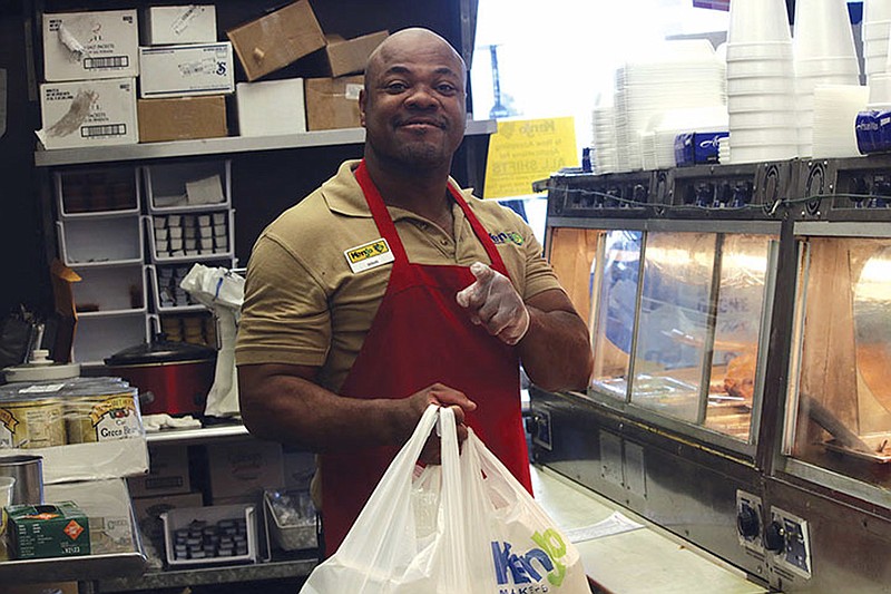 
              In this Aug. 11, 2017 photo, Doug Battle poses at Kenjo Market in Johnson City, Tenn. Battle spent most of his adult life trying to get a photo ID, but an incomplete birth certificate, which identified him as Twin B Male, stood in the way until a Tennessee judge issued an order officially giving Battle a name. (Becky Campbell/The Johnson City Press via AP)
            