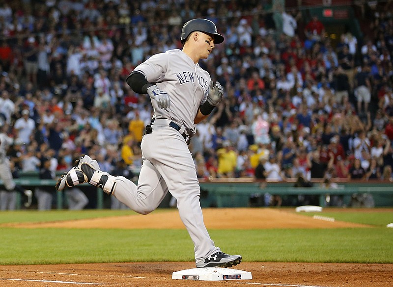 
              New York Yankees' Tyler Austin rounds the bases after his three-run home run against the Boston Red Sox during the second inning of a baseball game at Fenway Park in Boston on Saturday, Aug. 19, 2017. (AP Photo/Winslow Townson)
            