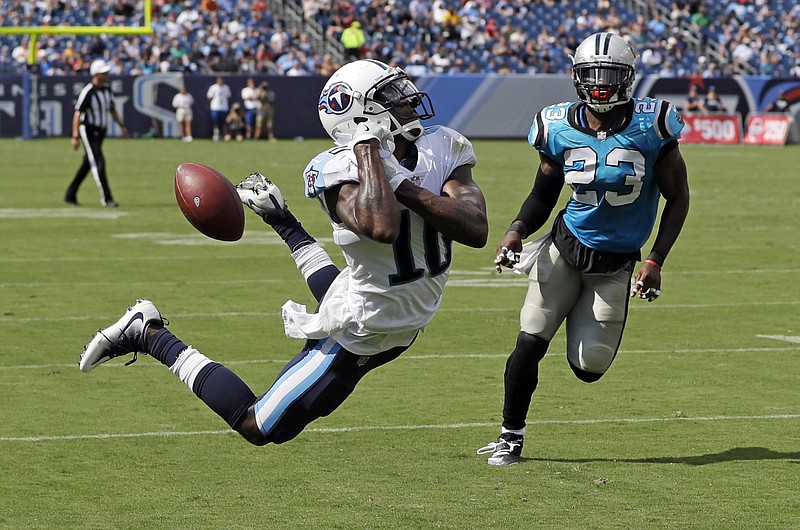 Tennessee Titans wide receiver Tre McBride (10) cannot hold onto a pass in the end zone as he is defended by defensive back L.J. McCray (23) in the first half of an NFL football preseason game Saturday, Aug. 19, 2017, in Nashville, Tenn. (AP Photo/James Kenney)
