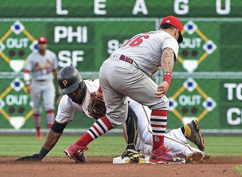 
              Pittsburgh Pirates' Starling Marte (6) steals second base as St. Louis Cardinals' Kolten Wong (16) makes a late tag in the fourth inning of a baseball game in Pittsburgh, Saturday, Aug. 19, 2017. (AP Photo/Fred Vuich)
            