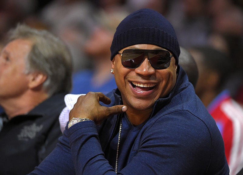 
              FILE - In this Nov. 3, 2014 file photo, rapper/actor LL Cool J watches the Los Angeles Clippers play the Utah Jazz during the first half of an NBA basketball game, in Los Angeles. The John F. Kennedy Center for the Performing Arts announced the recipients of the 2017 Kennedy Center Honors. They are: hip-hop artist LL Cool J, singers Gloria Estefan and Lionel Richie, television writer and producer Norman Lear and dancer Carmen de Lavallade. It’s the 40th year of the awards, which honor people who have influenced American culture through the arts.  (AP Photo/Mark J. Terrill, File)
            