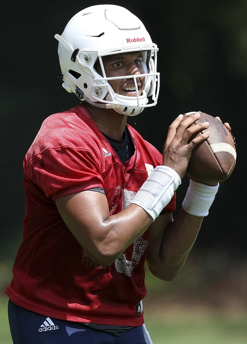 UTC quarterback Alejandro Bennifield runs a drill during the first day of fall practice at Scrappy Moore Field on Monday, July 24, in Chattanooga, Tenn.