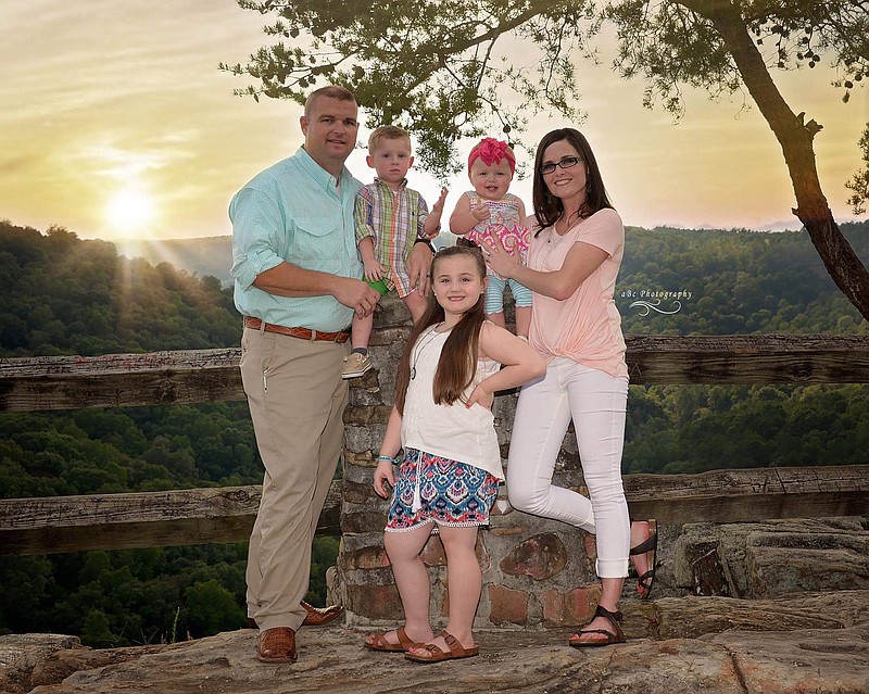 DeKalb County Chief Deputy Michael Edmondson poses with his wife, Jody, and their children, Paisley, Jeremiah and Alexis.