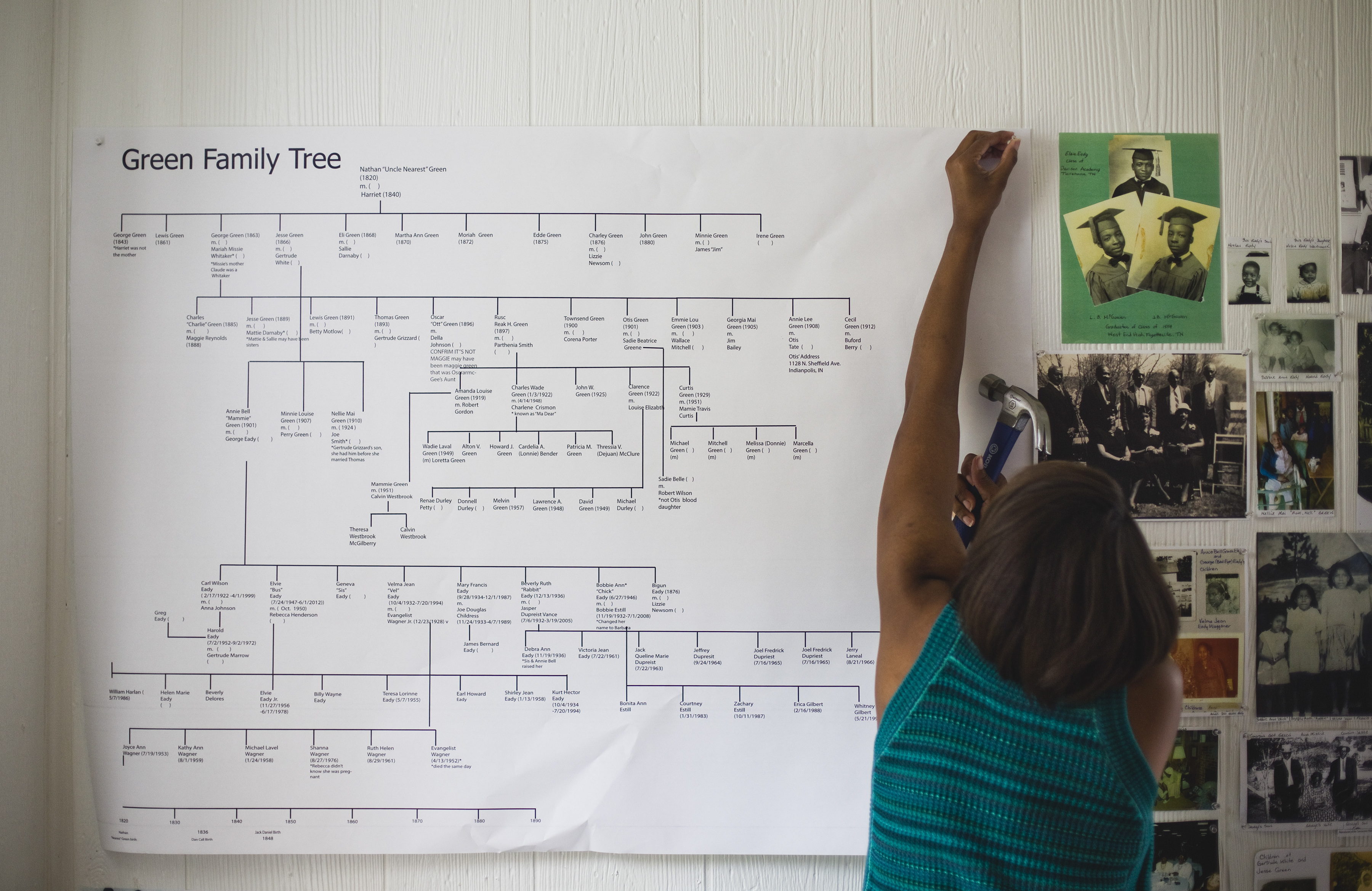 Fawn Weaver, who has been researching Nearest Green, the Tennessee slave who taught Jack Daniel how to make whiskey, tacks up a Green family tree in Lynchburg, Tenn., June 21, 2017. Weaver, a real estate investor and author, is on a mission to ensure that Green is properly recognized. (Nathan Morgan/The New York Times)