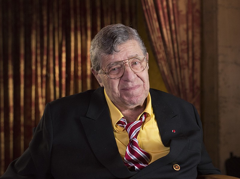 
              FILE - In this April 12, 2014, file photo, actor and comedian Jerry Lewis poses during an interview at TCL Chinese Theatre in Los Angeles. Lewis, the comedian and director whose fundraising telethons became as famous as his hit movies, has died. Lewis died Sunday, Aug. 20, 2017, according to his publicist. He was 91. (Photo by Dan Steinberg/Invision/AP Images, File)
            