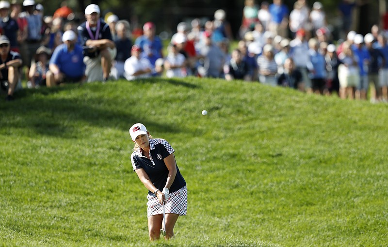 
              United States' Cristie Kerr hits to the first green during her singles match against Europe's Mel Reid, of England, in the Solheim Cup golf tournament, Sunday, Aug. 20, 2017, in West Des Moines, Iowa. (AP Photo/Charlie Neibergall)
            