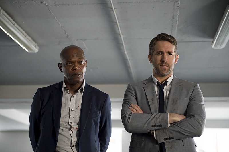 
              This image released by Lionsgate shows Samuel L. Jackson, left, and Ryan Reynolds in "The Hitman's Bodyguard." (Jack English/Lionsgate via AP)
            