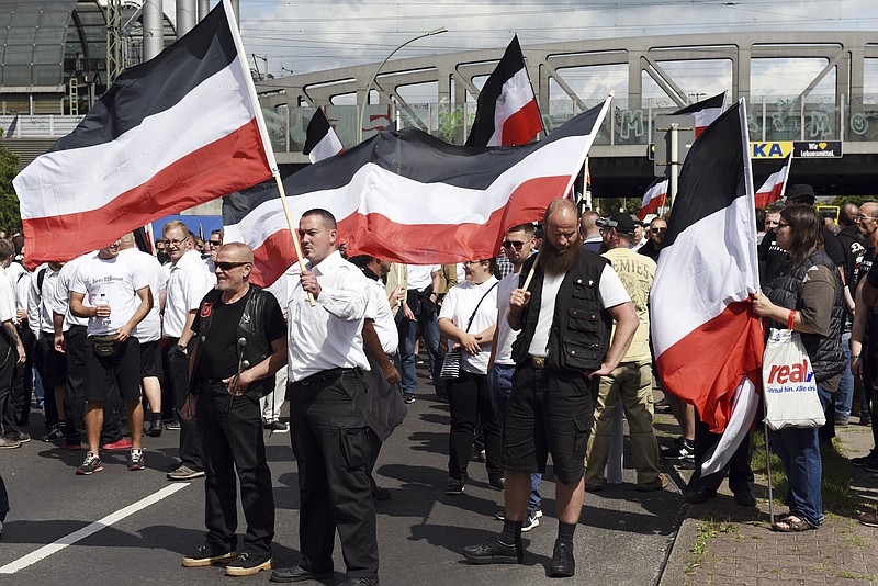 
              Far-right extremists gather to commemorate the death of Adolf Hitler's deputy, Rudolf Hess, in Berlin's western district  of Spandau, Saturday, Aug. 19, 2017.  Police are allowing the march, but participants are not allowed to glorify Hess, who died at Spandau prison 30 years ago. A counter demonstration is also expected.  (Maurizio Gambarini/dpa via AP)
            