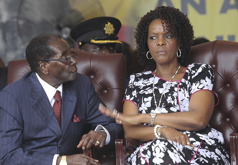 
              FILE - In this Saturday Feb. 27, 2016 file photo, Zimbabwe President Robert Mugabe, left, and his wife Grace attend his birthday celebrations in Masvingo, Zimbabwe. President Robert Mugabe is in South Africa as his wife is accused of assaulting a young model. (AP Photo/Tsvangirayi Mukwazhi, File)
            