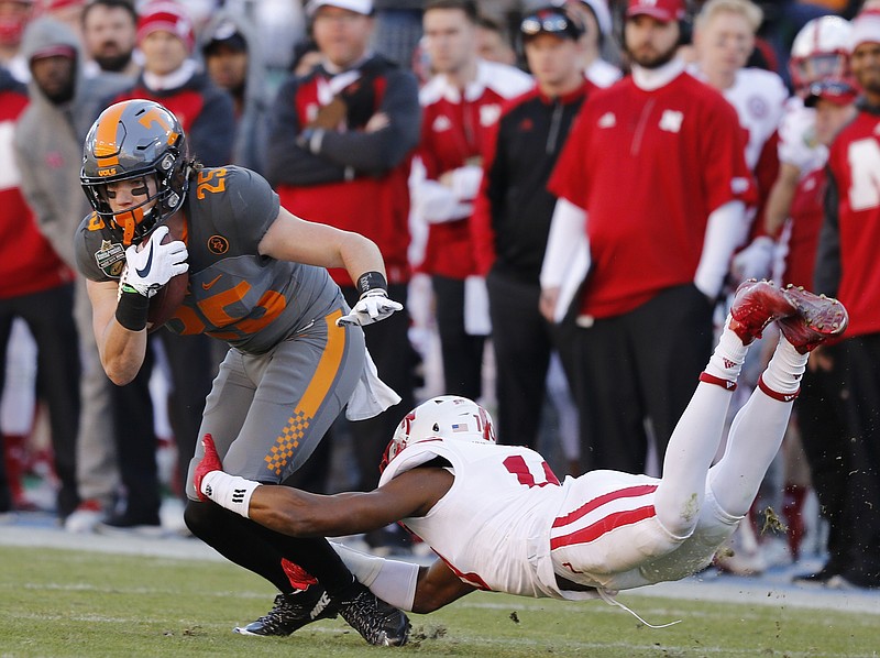 Tennessee wide receiver Josh Smith breaks a tackle by Nebraska defender Joshua Kalu in the first half of the Vols' Music City Bowl game against the Nebraska Cornhuskers at Nissan Stadium on Friday, Dec. 30, 2016, in Nashville, Tenn. Tennessee won 38-24.