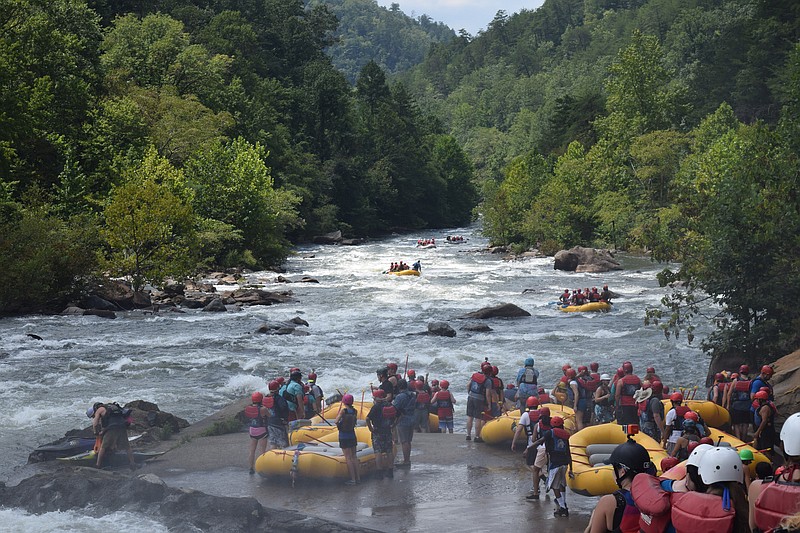 Rafters file into the Ocoee River Monday, Aug. 21, 2017, as they look forward to seeing the total solar eclipse from their rafts in Polk County, Tenn. While some rafting outfitters stayed off the river for the day, others including Big Frog Expeditions marketed the day as a once in a lifetime opportunity. 