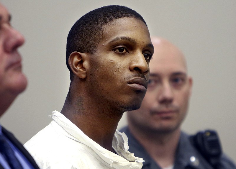 
              Anthony Rutherford listens during his arraignment in court in Waterbury, Conn., Monday, Aug. 21, 2017. Rutherford is accused of killing an anti-domestic violence activist and her 9-year-old daughter. (Steven Valenti/The Republican-American via AP, Pool)
            