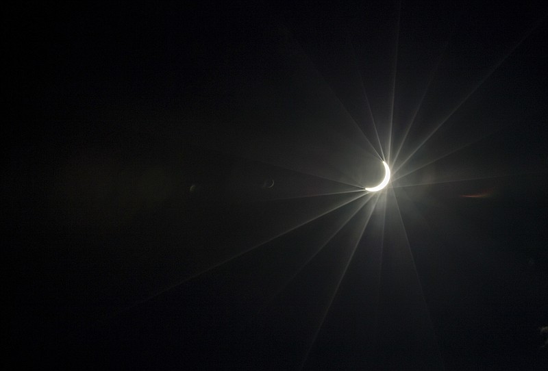 
              A near total solar eclipse is seen over midtown Atlanta, Monday, Aug. 21, 2017. (AP Photo/David Goldman)
            