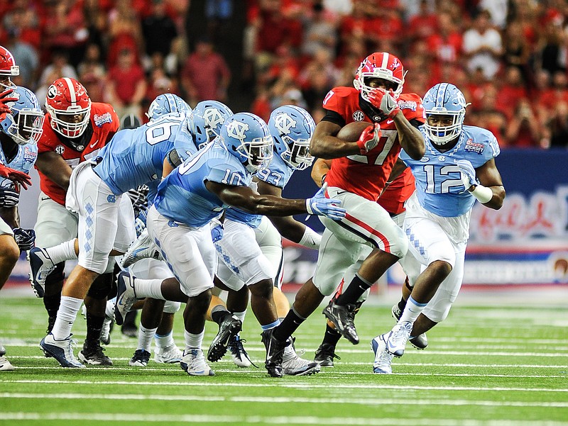 Georgia senior running back Nick Chubb plows through the North Carolina defense during last year's Chick-fil-a Kickoff Game.