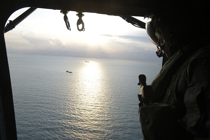 
              In this image provided by the Ministry of Defence Singapore, Republic of Singapore Air Force personnel conduct a search and rescue operation for missing U.S. sailors over waters east of Singapore, on Monday, Aug. 21, 2017. The U.S. Navy ordered a broad investigation Monday into the performance and readiness of the Pacific-based 7th Fleet after an early morning collision between the USS John S. McCain and an oil tanker in Southeast Asian waters which left a number of U.S. sailors missing and others injured. (Ministry of Defence Singapore via AP)
            