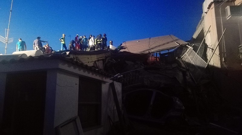 
              This handout picture provided by Italian Carabinieri police shows rescuers at work among damaged houses in the island of Ischia, southern Italy, Tuesday, August 22, 2017. An earthquake rattled the Italian resort island of Ischia at the peak of tourist season Monday night, killing at least one person and trapping a half dozen others, including children, under collapsed homes. Italy's national vulcanology agency put the initial magnitude at 3.6, though it revised it to a 4.0 sustained magnitude with a shallow depth of 5 kilometers (3 miles) in the waters just off the island. (Italian Carabinieri, HO/ANSA via AP)
            