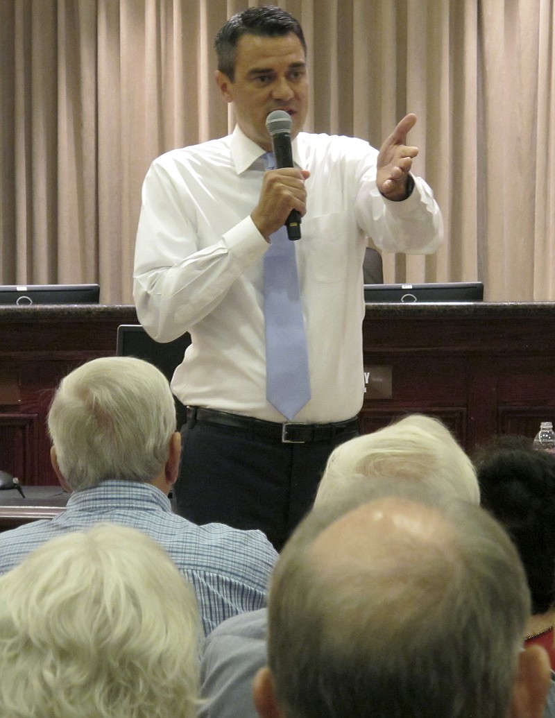 
              U.S. Rep. Kevin Yoder, R-Kan., answers questions about health care and other issues during a town hall meeting, Tuesday, Aug. 22, 2017, at the city hall in Olathe, Kan. National Democrats already are targeting Yoder for next year's election in a district that President Donald Trump narrowly lost last year. (AP Photo/John Hanna)
            