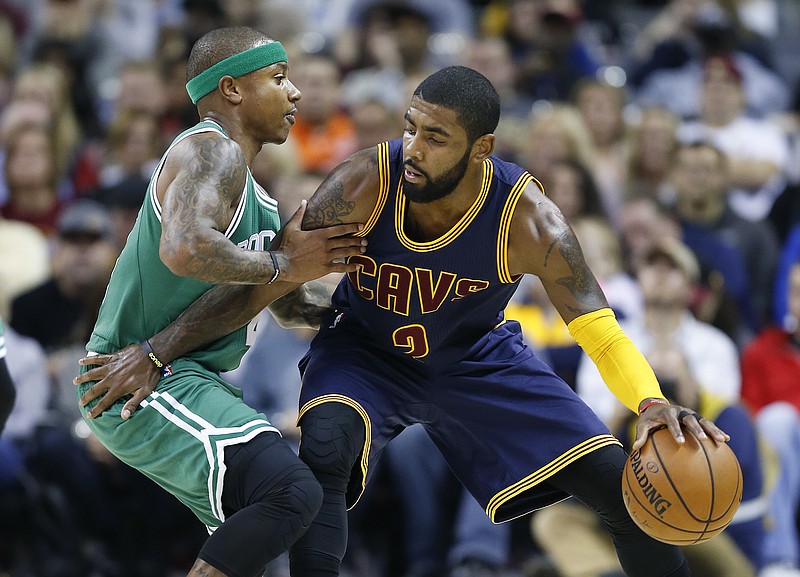 
              FILE - In this Nov. 3, 2016, file photo, Cleveland Cavaliers' Kyrie Irving, right, looks to drive against Boston Celtics' Isaiah Thomas during the first half of an NBA basketball game in Cleveland. Irving, who asked Cavaliers owner Dan Gilbert to trade him earlier this summer, could be on his way to Boston as the Cavaliers are in serious negotiations with the Celtics about swapping him for point guard Thomas. Since Irving made his stunning request, the defending Eastern Conference champions have been looking for a trade partner. They may have found the perfect one and could be nearing a deal with the Celtics, said the person who spoke Tuesday night, Aug. 22, 2017, to The Associated Press on condition of anonymity because of the sensitivity of the talks. (AP Photo/Ron Schwane, File)
            