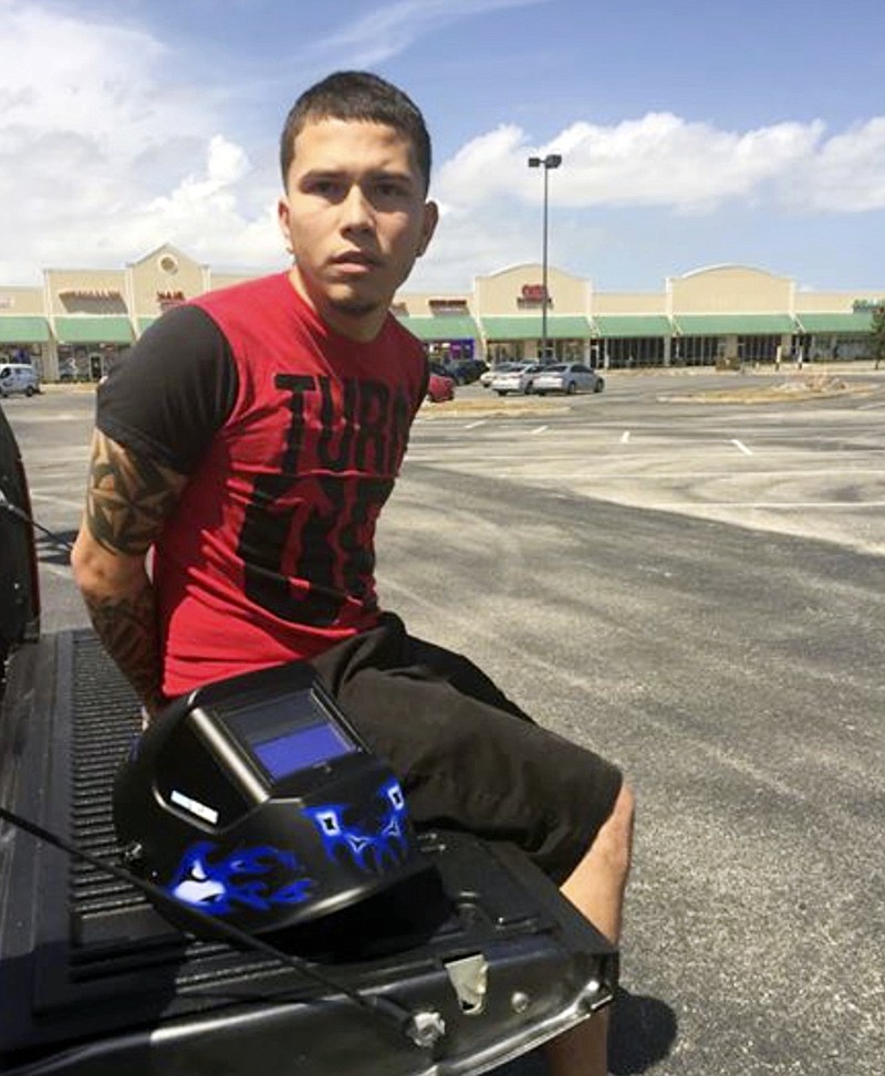 This photo provided by the Orange County Sheriff''s office shows Jocsan Rosado after he was arrested Monday, Aug. 21, 2017 when he parked a stolen car to watch the solar eclipse, in Orlando, Fla. The sheriff's office says he was arrested next to the stolen car, wearing a welding mask and looking up at the sky. (AP Photo via Orange County Sheriff's Office)