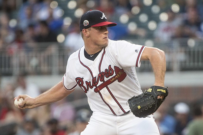 Atlanta Braves' Lucas Sims pitches against the Seattle Mariners during the first inning of a baseball game, Tuesday, Aug. 22, 2017, in Atlanta. (AP Photo/John Amis)